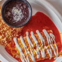 Cheese Enchilada · Vegetarian. Blend of jack and cheddar cheeses rolled in a pair of corn tortillas covered wit...