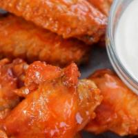 Buffalo Wings · Unbreaded chicken wings section coated in Buffalo sauce. Oven baked.
Dipping Sauce: Ranch, B...
