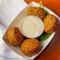Falafel · Fried ball of patty made from ground chickpeas, sesame seeds and parsley.