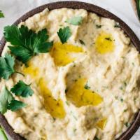 Babaghanous​h (8 oz) With Pita · A puree of roasted eggplant with garlic, lemon juice, parsley and tahini. Served with pita b...