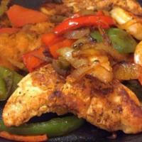 Chicken & Shrimp Fajitas · Grilled 8 oz. of chicken combined with jumbo shrimp, onions, bell peppers, and tomato, serve...