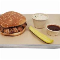 Smoked Pulled Pork Sandwich | BBQ Sandwich · 5oz of smoked pulled pork in a bun, served with your choice of side, sauce, and pickle or ja...