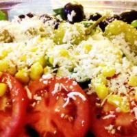 Greek Salad · Lettuce, tomatoes, cucumbers, pepperoncini, green pepper, oregano, onion, capers with Greek ...
