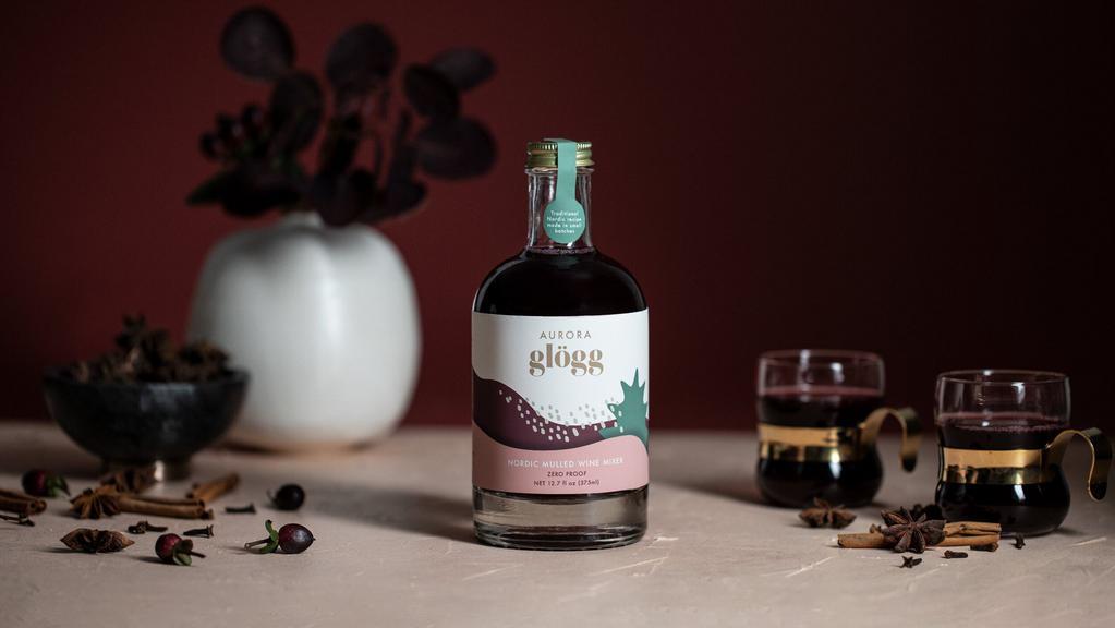 Aurora Glogg, bottle · Non-Alcoholic
Add to your favorite wine or spirits.
A winter-spiced, black currant mixer that pays homage to the Nordic holiday tradition. Traditional Nordic recipe, made in small batches.  
For mulled wine, cocktails and non-alcoholic drinks.  Real berries and botanicals • No artificial flavorings • Crafted in small batches  •  Zero proof

Ingredients: Concord grape juice from concentrate (water, concord grape juice concentrate, ascorbic acid), cane sugar, blueberry puree, black currant puree (black currants, water), spices.

High-quality ingredients are the soul of Aurora. No artificial or “natural” flavors, only 100% real stuff. Gluten-Free and GMO-Free (we’re working on our certifications).