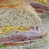 10. The 3 Meat Ultimate Sandwich · Roast beef, ham and turkey piled high on freshly baked sourdough. Includes lettuce, tomato, ...