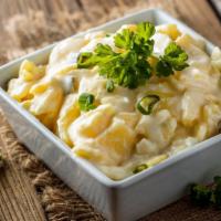Potato Salad · Chunks of seasoned potatoes in creamy, light sauce.