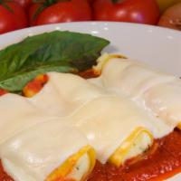 Manicotti (3) · Pasta stuffed with ricotta cheese, topped with marinara sauce and mozzarella.