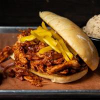 Regular Firebird · Our smoked chicken, pulled and tossed in a spicy BBQ sauce.  Served with your choice of side.