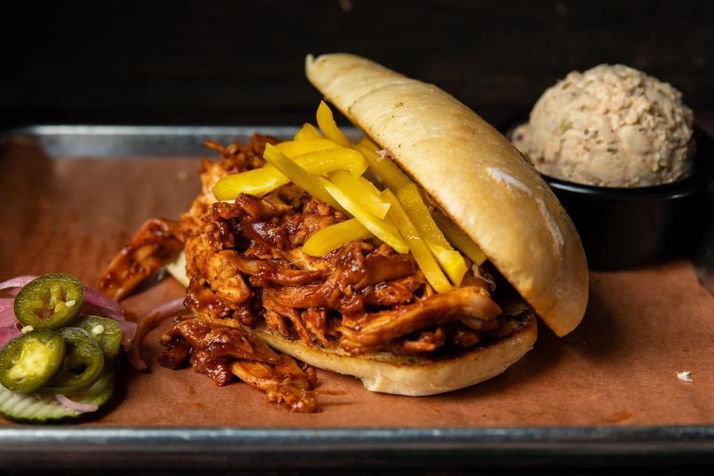 Regular Firebird · Our smoked chicken, pulled and tossed in a spicy BBQ sauce.  Served with your choice of side.
