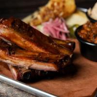 Regular Rib Meal · Four of our St. Louis style pork ribs. .  Served with your choice of two sides and bread.