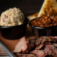 Regular Tri Tip Meal · Our hand cut smoked tri-tip served with your choice of two sides and bread.