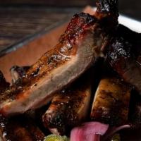 Quarter Rack Ribs · St Louis style pork ribs with our original BBQ sauce