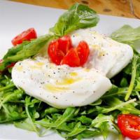 Burrata · Served over arugula with cherry tomatoes.