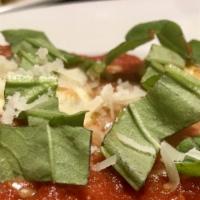Lasagna · Home made with classic bolognese sauce, ricotta, and mozzarella.