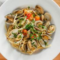 Linguine Vongole · Manila clams and cherry tomatoes in white wine sauce.