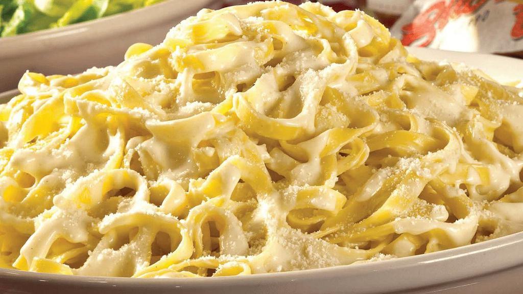 Fettuccine Alfredo · Classic favorite featuring fettuccine tossed with our creamy homemade Alfredo sauce . {VT}