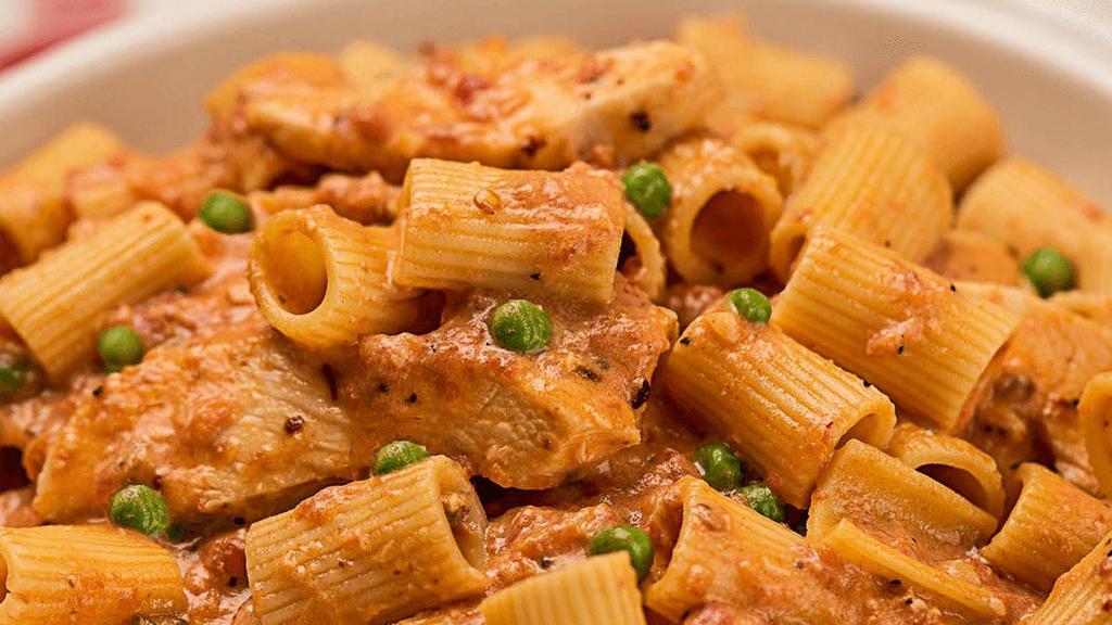Spicy Chicken Rigatoni · Chicken breast, garlic, crushed red pepper & peas in spicy rosa sauce .