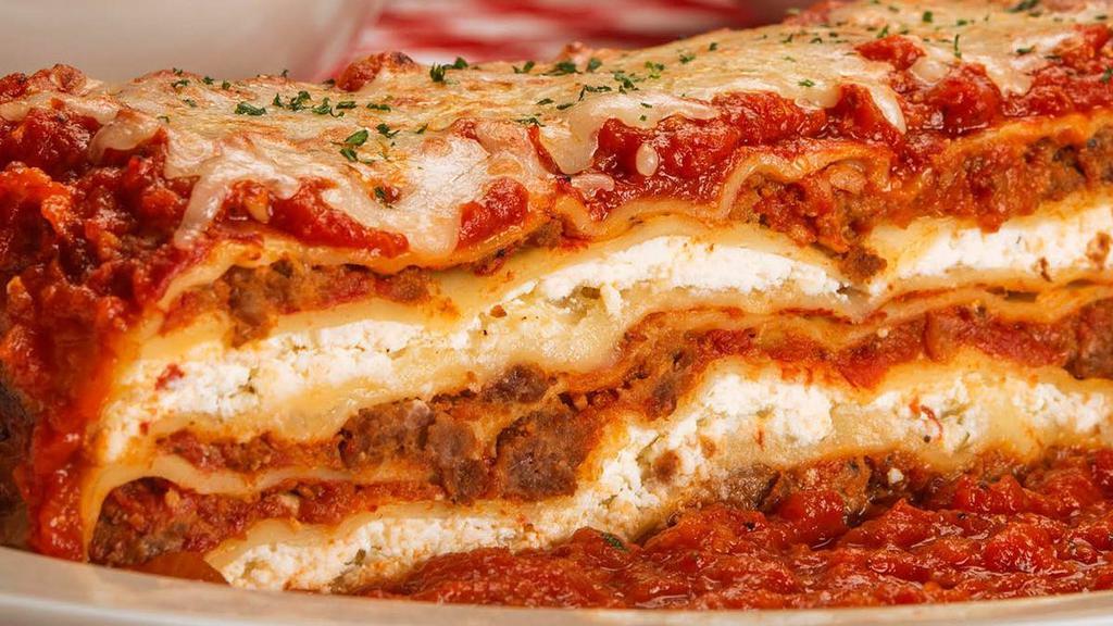 Lasagna · Towering layers of meat sauce, ricotta, mozzarella, provolone & parmesan . {B}