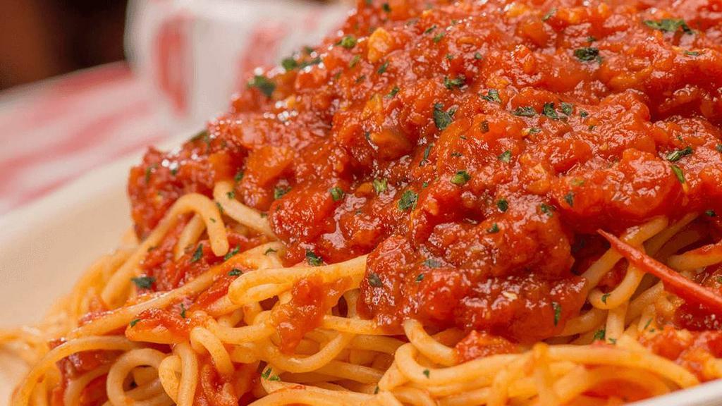Spaghetti Marinara · Our homemade marinara sauce served on a bed of spaghetti . {VT}