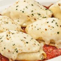 Stuffed Shells · pasta shells filled with spicy Italian sausage, spinach, ricotta & parmesan with Alfredo & o...