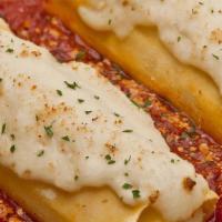 Cheese Manicotti · Pasta tubes filled with ricotta, mozzarella & parmesan with Alfredo & our homemade marinara ...