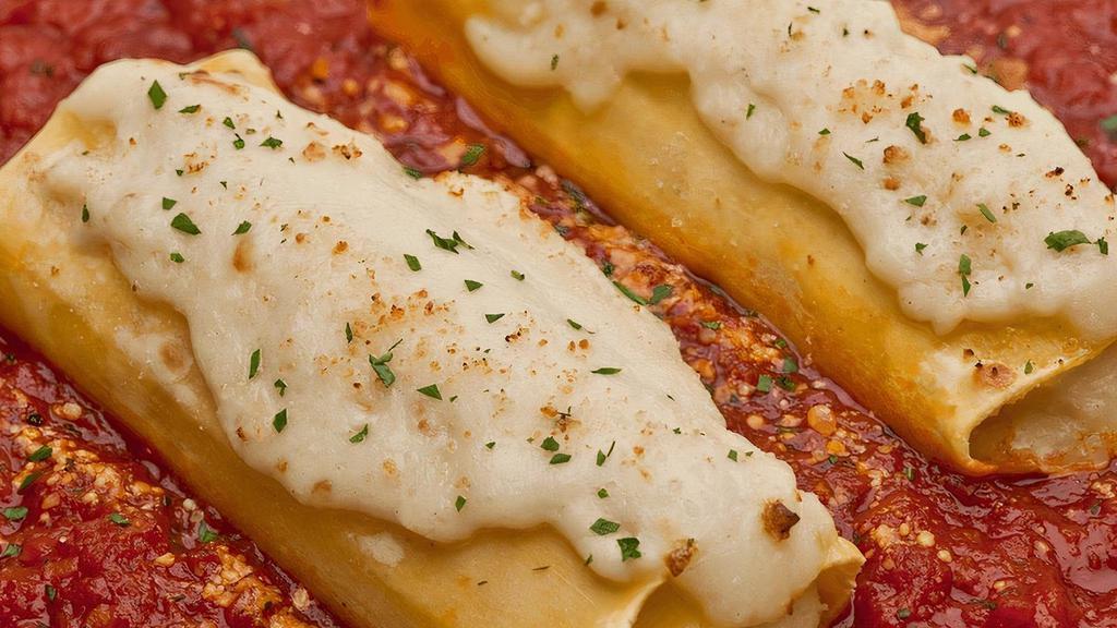 Cheese Manicotti · Pasta tubes filled with ricotta, mozzarella & parmesan with Alfredo & our homemade marinara sauce . {VT}