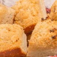 Garlic Bread · our Italian loaf brushed with garlic-infused olive oil, then baked with Parmesan cheese & lo...