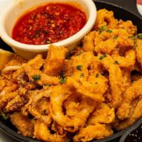 Spicy Shrimp · Golden fried shrimp & pepperoncini tossed with a spicy sauce of chilies & garlic . {SP}