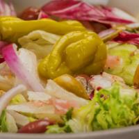 Mixed Green · Mixed lettuce tossed in our signature Italian vinaigrette with Roma tomatoes, red onions, pe...