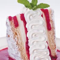 Italian Creme Cake · Six layers of rich lemon cake and mascarpone cheese filling, served in a pool of raspberry s...
