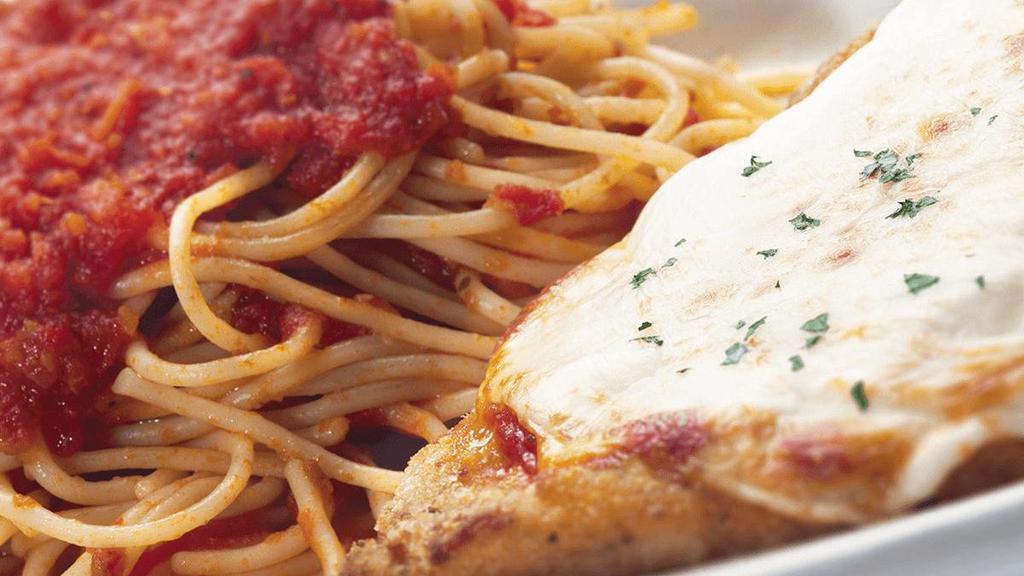Chicken Parmigiana · topped with our homemade marinara sauce, Roma tomatoes, basil & mozzarella served with a side of spaghetti marinara.