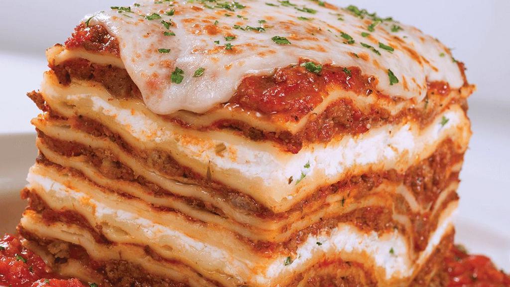 Lasagna · towering layers of meat sauce, ricotta, mozzarella, provolone & parmesan .