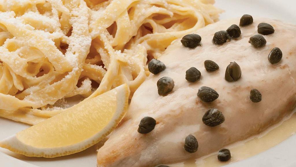 Chicken Limone · lemon butter sauce & capers served with a side of fettuccine alfredo.