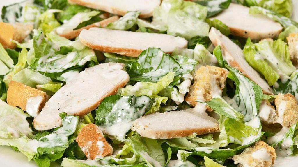 Chicken Caesar · Romaine hearts tossed in our signature Caesar dressing with roasted garlic croutons & parmesan.