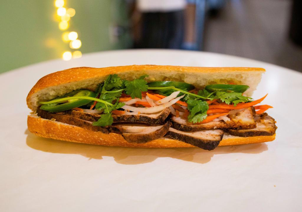 BM9. Wood-Smoked Pork Belly · Wood-smoked pork belly with barbecue sauce in a Vietnamese style baguette.