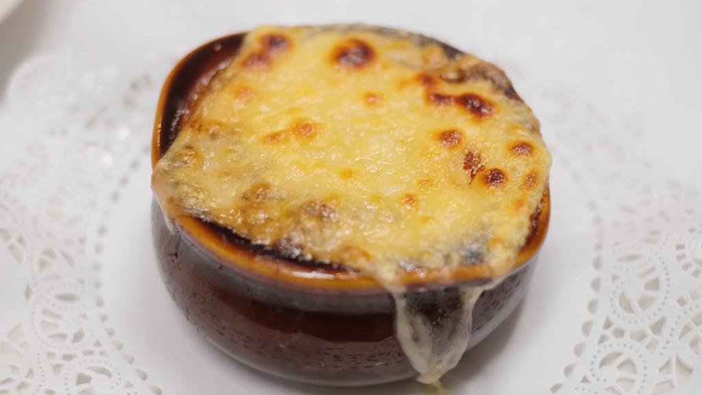 French Onion Soup · With a crostini and melted cheese.