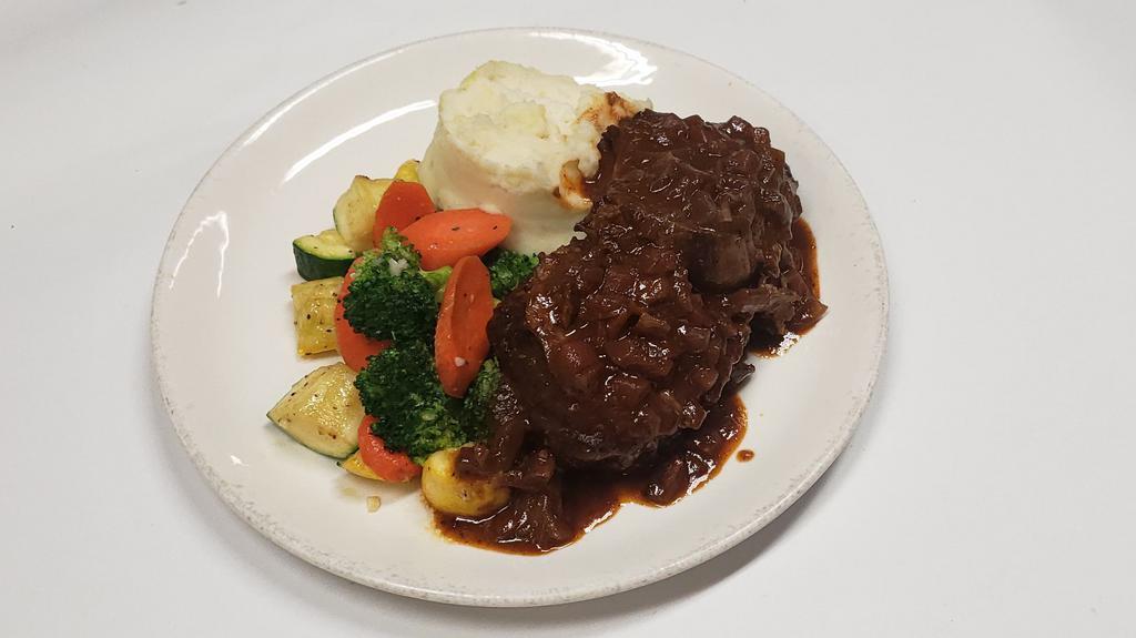 Rustic Pot Roast · Slow braised with a savory sauce served over mashed potato.