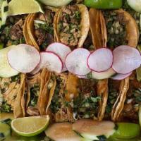 24 Taco Tray · Two of our 12 taco trays. Our delicious street tacos with the meat of your choice, onions an...