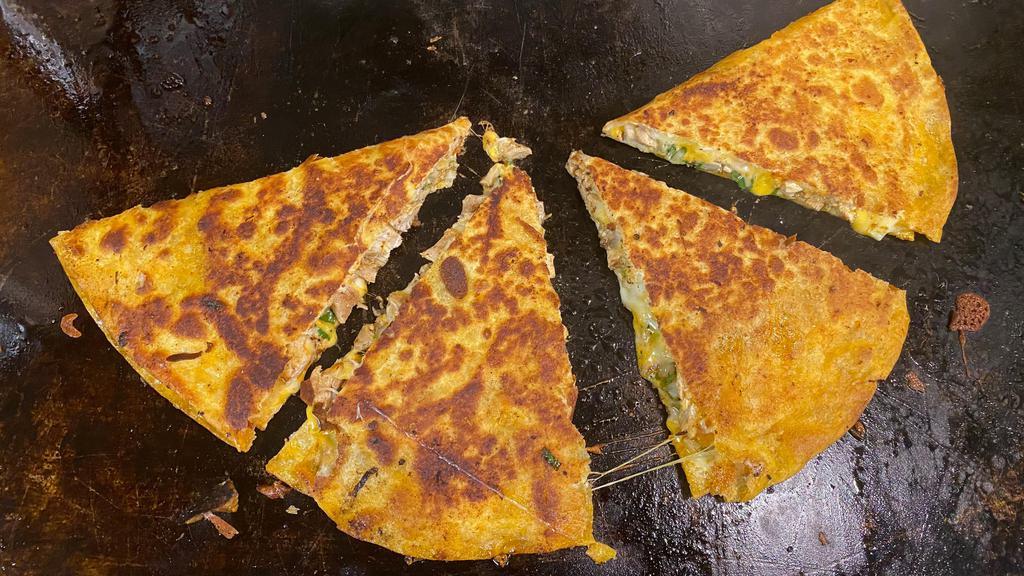 Quesabirria Quesadilla and 8 oz Consome · Quesabirria quesadilla and 8 oz consome: made just like our quesabirrias but on a large 14 inch tortilla. Comes with a side of consommé.