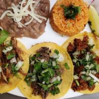 Three (3) Street Tacos with Rice and Beans · Our delicious street tacos topped with onions and cilantro with a side of rice and beans. Nu...
