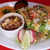 Three (3) Super Crispy Tacos Plate with Rice & Beans · Our crispy tacos are made with your choice of meat topped with shredded lettuce, cheese, sou...