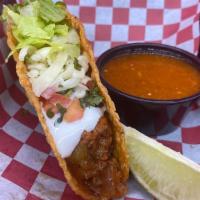 Super Crispy Taco · Our super crispy tacos come on a hard shell and are made with your choice of meat topped wit...