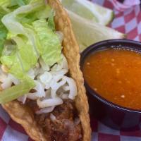 Crispy Taco · Our crispy tacos come on a hard shell and are made with your choice of meat topped with shre...
