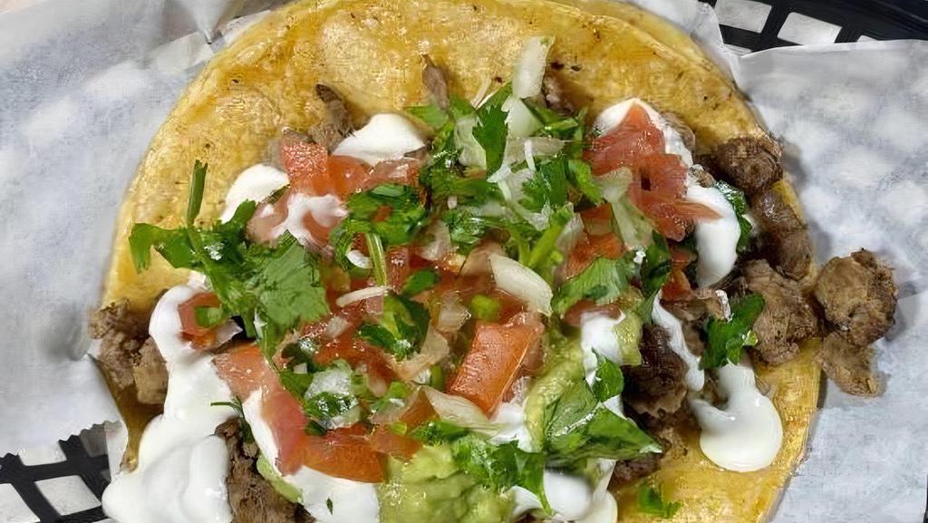 Super Taco de Asada · Our super taco is made with a large tortilla topped with meat, cheese, pico de gallo, guacamole, and sour cream. Be sure to add salsa from our salsa and sides sections.