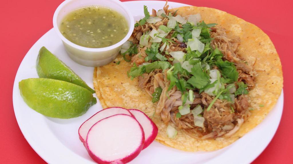 Large Taco: Carnitas (Fried Pork) · A large tortilla with the meat of your choice topped with onions and cilantro.