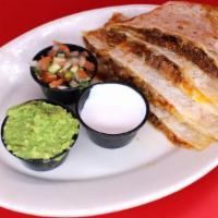 Birria Super Quesadilla · Your choice of meat on our large flour tortilla with melted cheese served with guacamole, so...