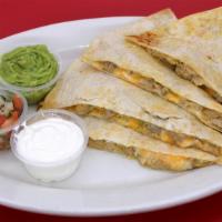 Chicken Super Quesadilla · Your choice of meat on our large flour tortilla with melted cheese served with guacamole, so...