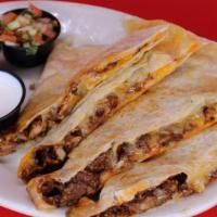 Al Pastor Super Quesadilla · Your choice of meat on our large flour tortilla with melted cheese served with guacamole, so...