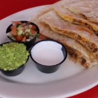 Carnitas Super Quesadilla · Your choice of meat on our large flour tortilla with melted cheese served with guacamole, so...