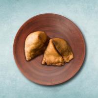 Vegetarian Samosa  · Indian pastry filled with potato, peas, and Indian spices. Served with a side of our sweet a...